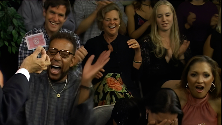 Audience enjoying a magic show with diverse reactions and expressions